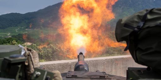 An M1A2 SEP v2 Abrams assigned to Bravo Company, 4th Battalion, 70th Armored Regiment, 1st Armored Brigade Combat Team, 1st Armored Division, fires at a target during a zero range at Rodriguez Live-Fire Complex, South Korea, Aug. 5, 2024. The unit is participating in a deployment readiness exercise in support of Operation Pacific Fortitude, which supports long-standing agreements to the Republic of Korea by deploying forces, drawing and transporting equipment to validate unit readiness and the U.S. commitment to the alliance.